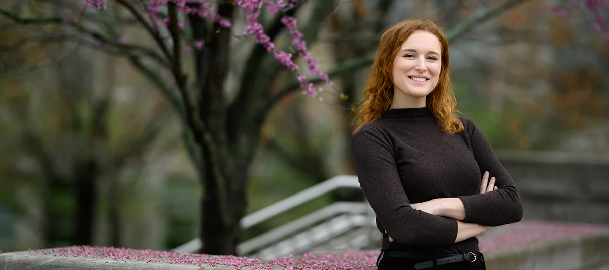 An MBA student outside on campus